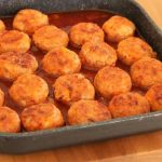 Meat and brown rice balls in sauce