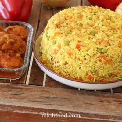 Yellow rice with carrots and peas